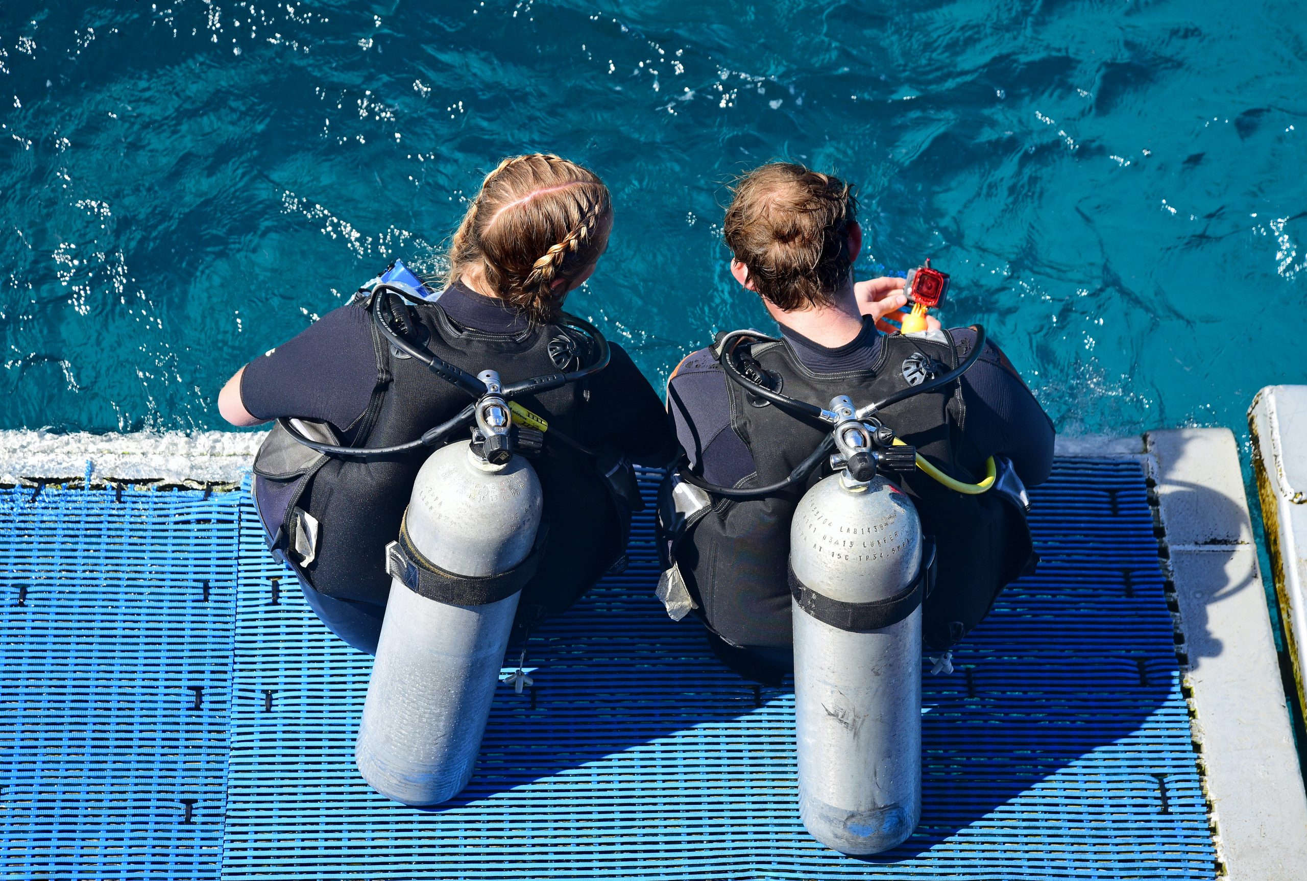 girls with scuba diving tanks on